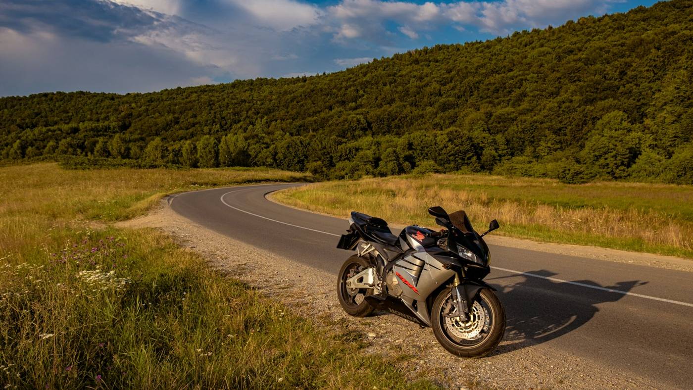 Sport motorcycle parked on a curving country road