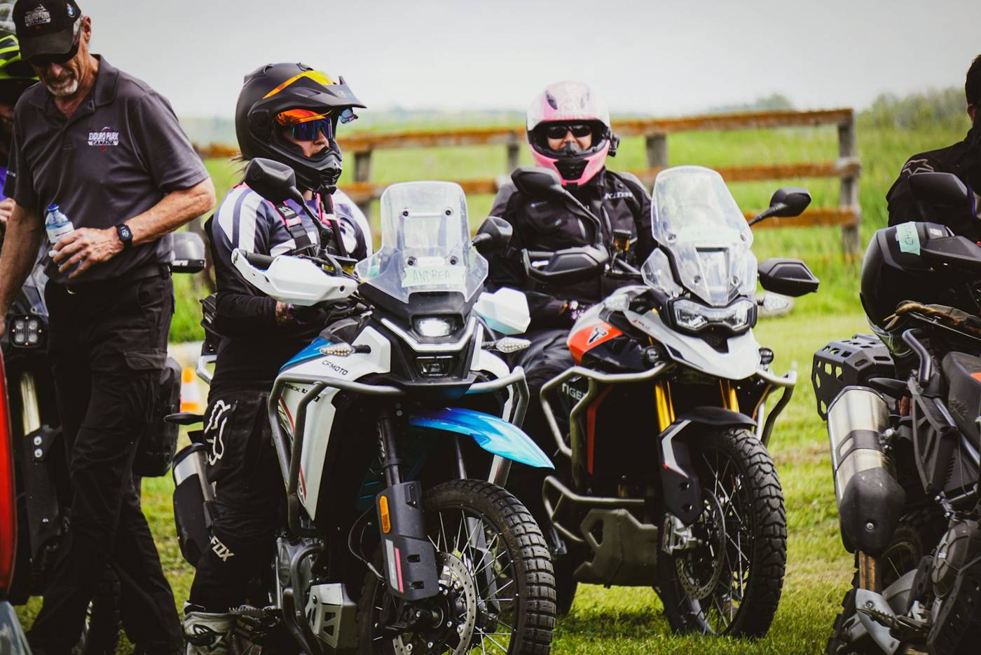 Riders together Riders talking together beside their adventure motorcycles at a riding event