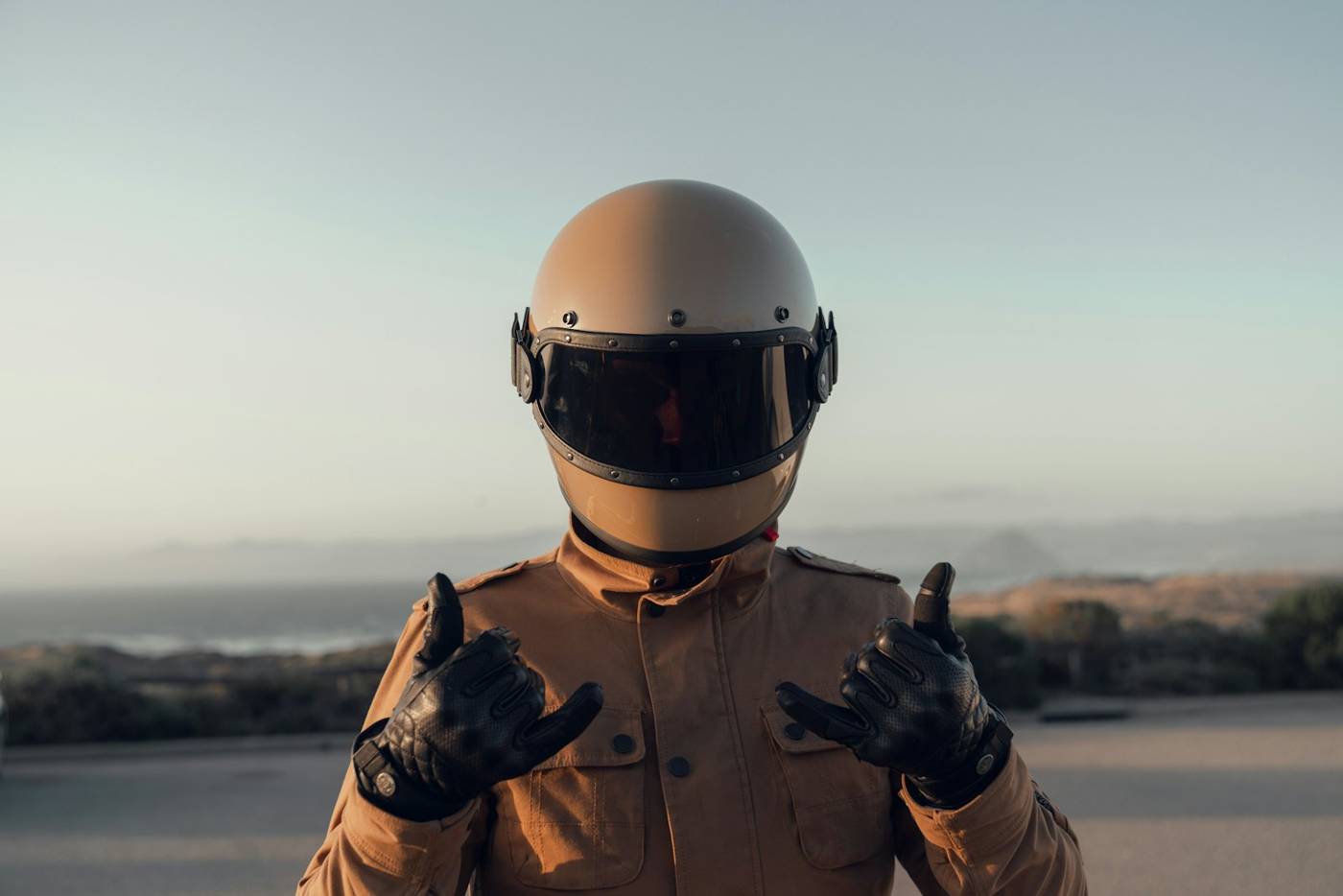 Rider wearing a motorcycle helmet and riding jacket