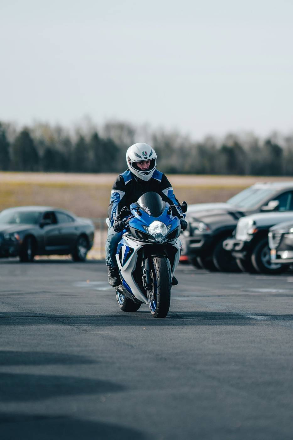 First laps in a parking lot New motorcycle rider practicing in an empty parking lot